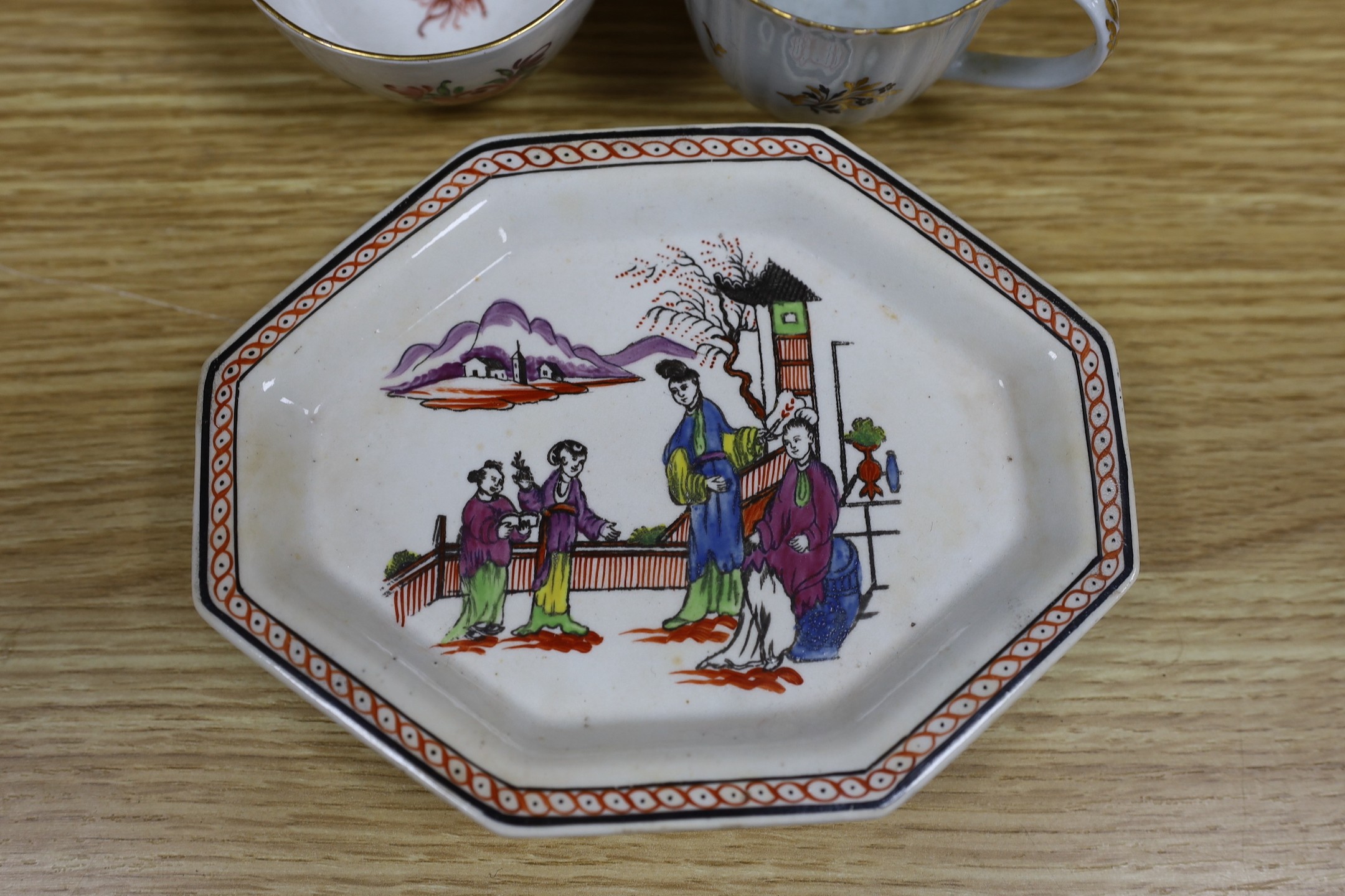 A Newhall saucer dish painted with pattern 85, octagonal Newhall-type spoon tray, clip-handled coffee cup painted with flowers, two ridge handled coffee cups, New Hall pattern 430 coffee cup, Newhall teapot and eight oth